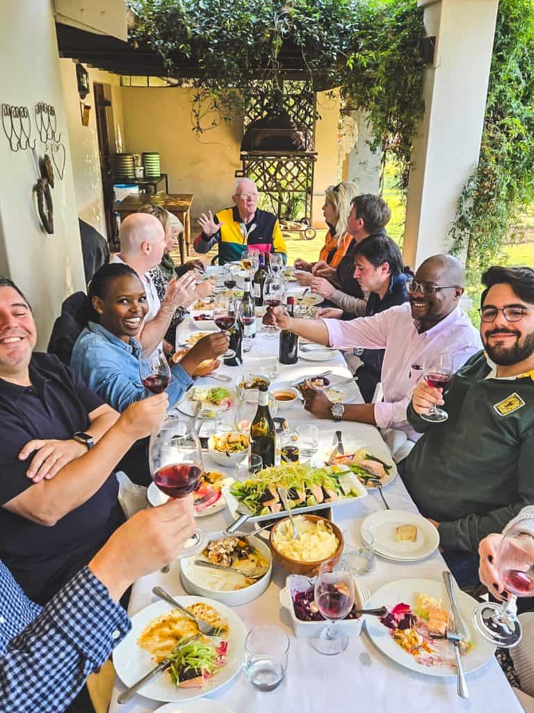 a90f549d-1544-1e01-174e-212c2c41f158 Wine Club Members enjoying lunch